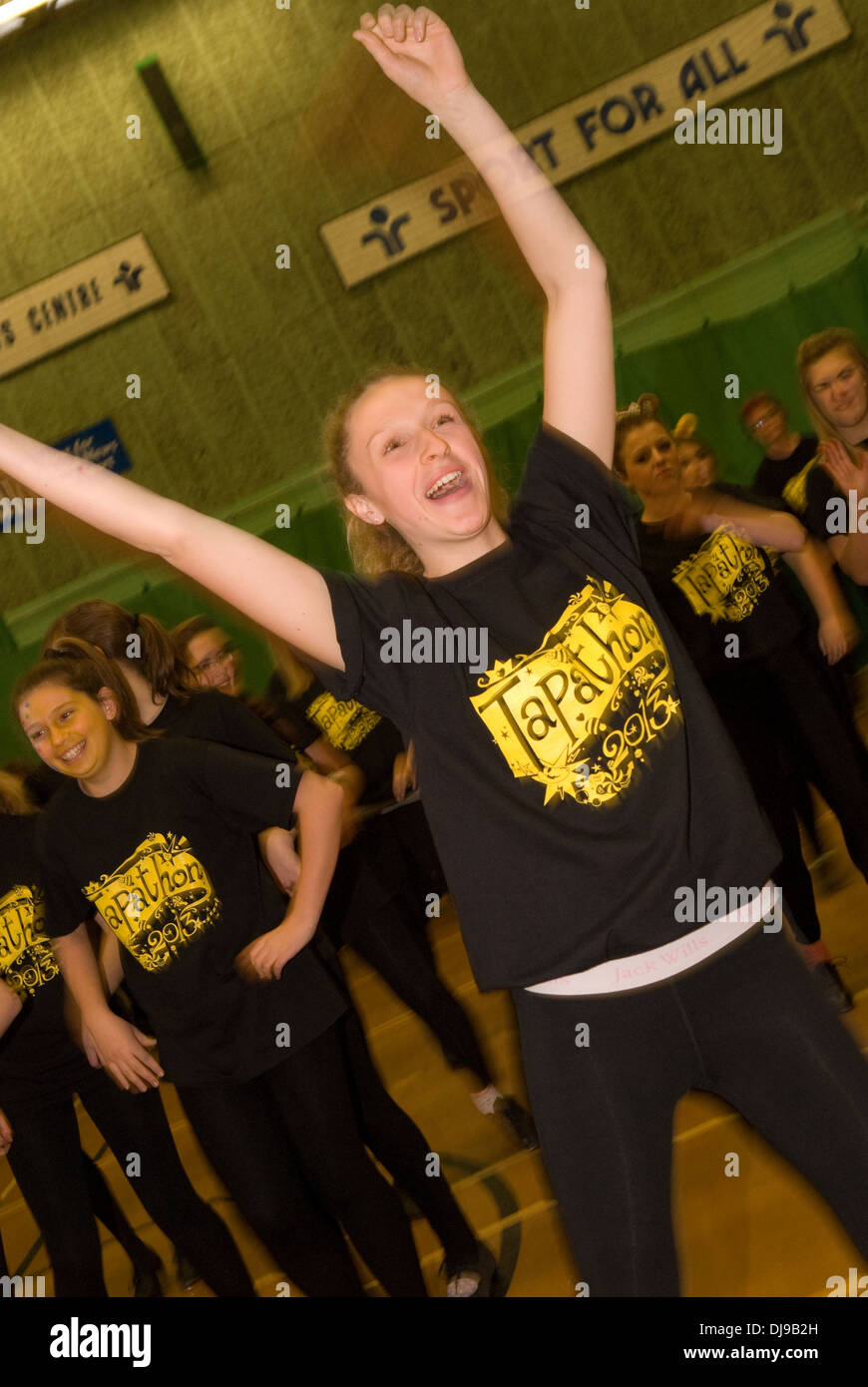 15 year old girl & dance troupe taking part in a nationwide Tapathon for Children in Need 2013, Alton, Hampshire, UK. Stock Photo