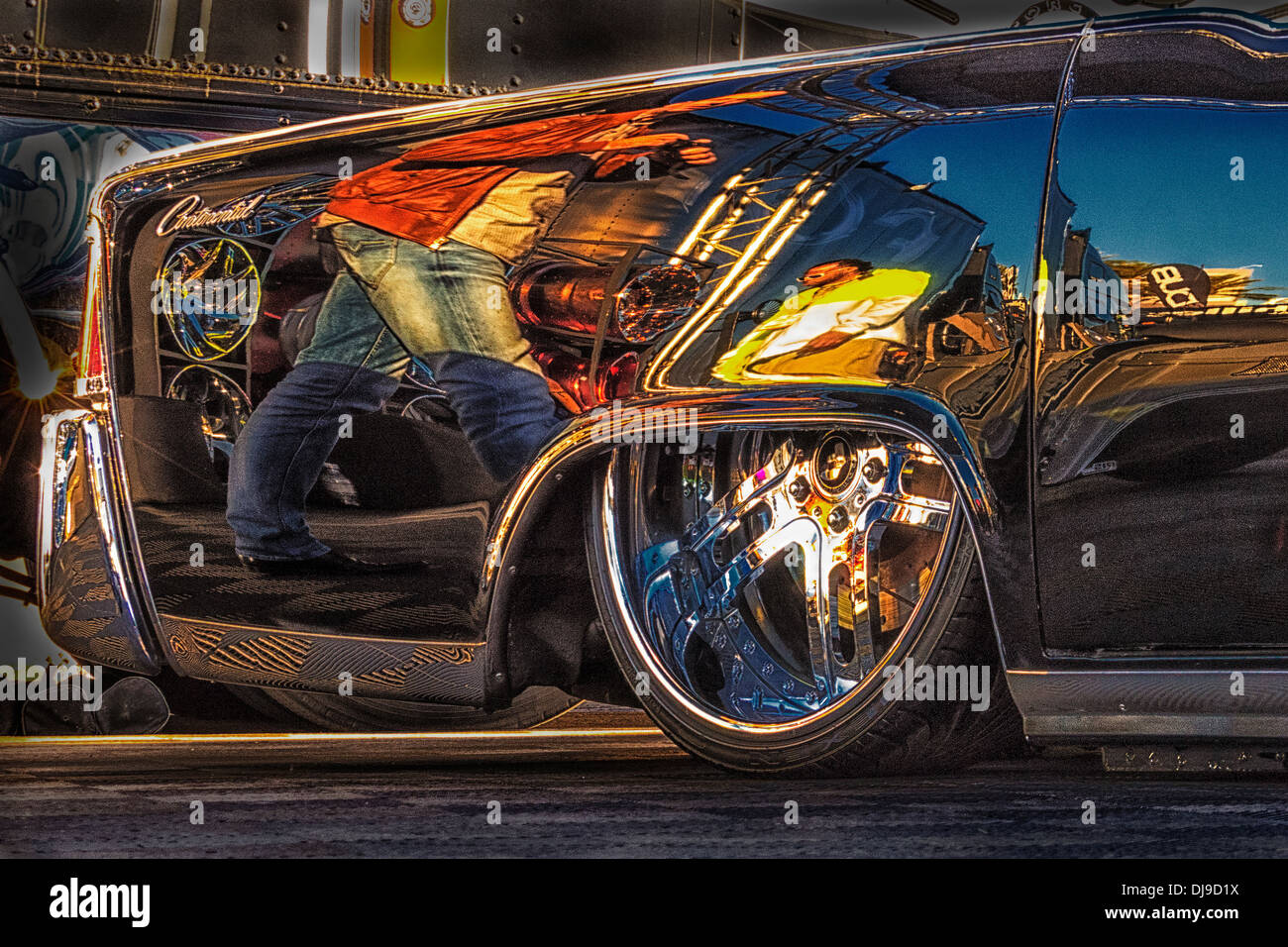 dramatic editorial image of reflections in the rear quarter panel of a 1964 Lincohn Stock Photo