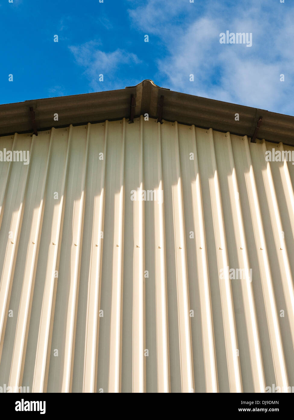 Modern corrugated metal walled farm building - France. Stock Photo