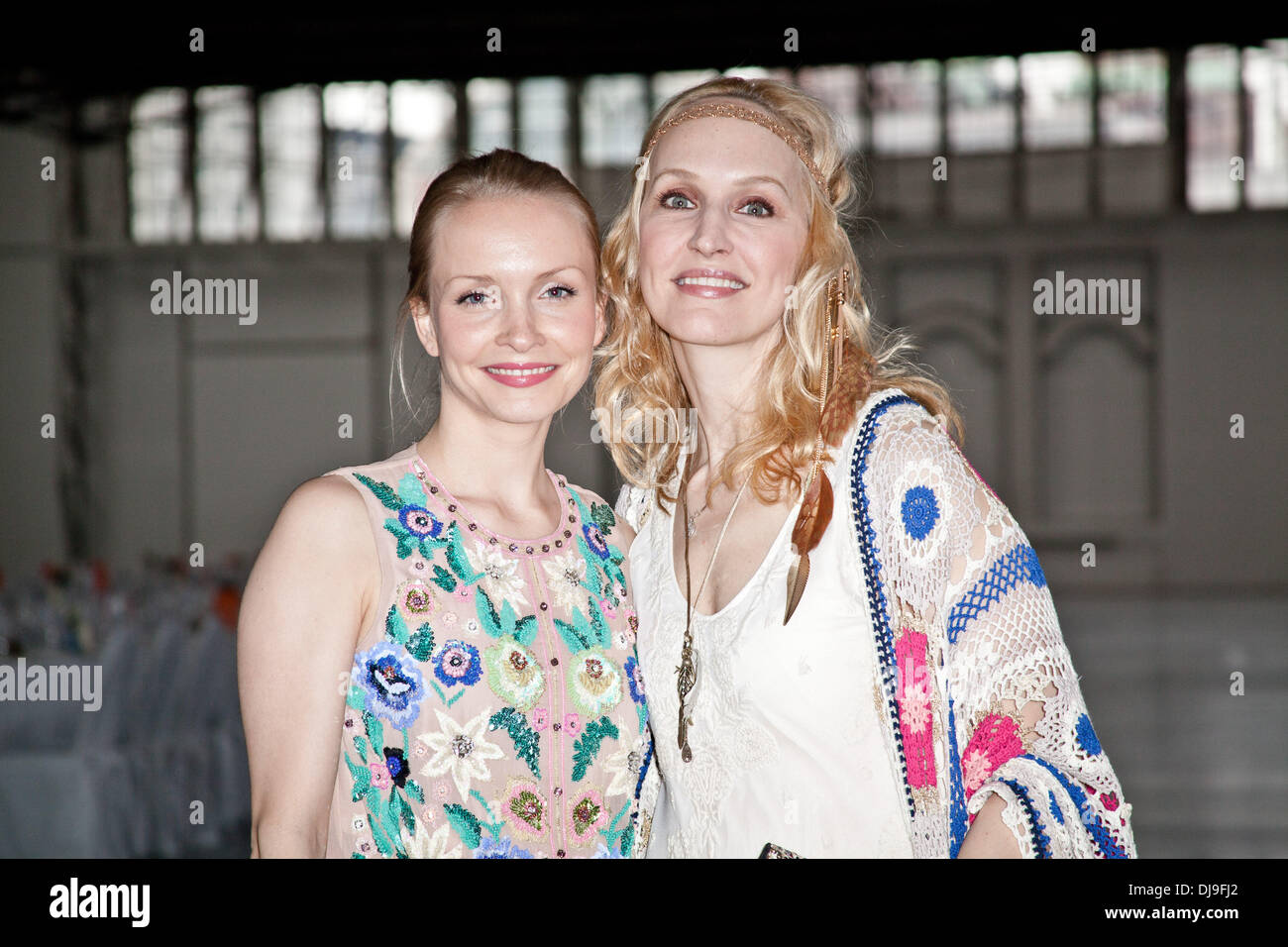 Janin Reinhardt and Anne Meyer-Minnemann at a Next Art Generation gala honoring british artist Antony Gormley at Deichtorhallen. All guests had to take off their shoes for the event. Hamburg, Germany - 25.04.2012 Stock Photo