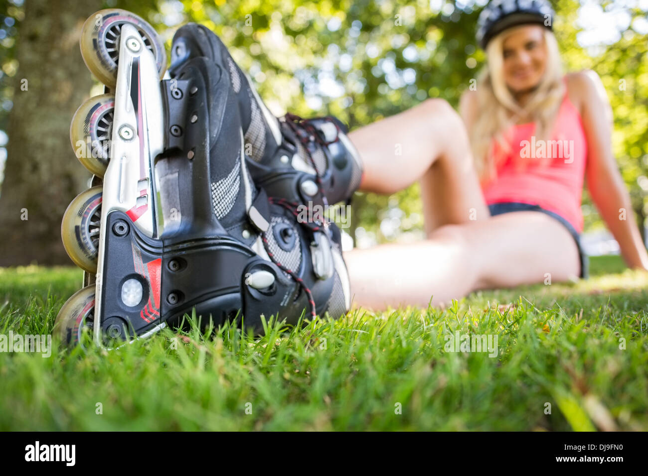 Casual attractive blonde wearing roller blades Stock Photo