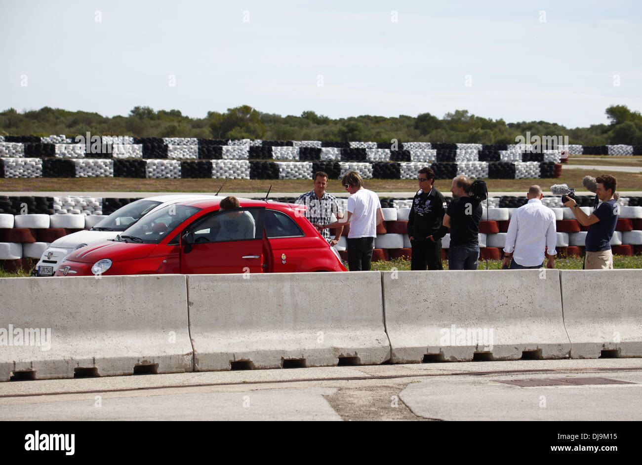 Lance David Arnold, Mickie Krause and Andy Bar filming a car race for German VOX TV show 'Promis am Limit' at Circuito Mallorca race track near El Arenal. Before the race, racing driver Lance David Arnold gives Krause and Bar an introduction into race dri Stock Photo