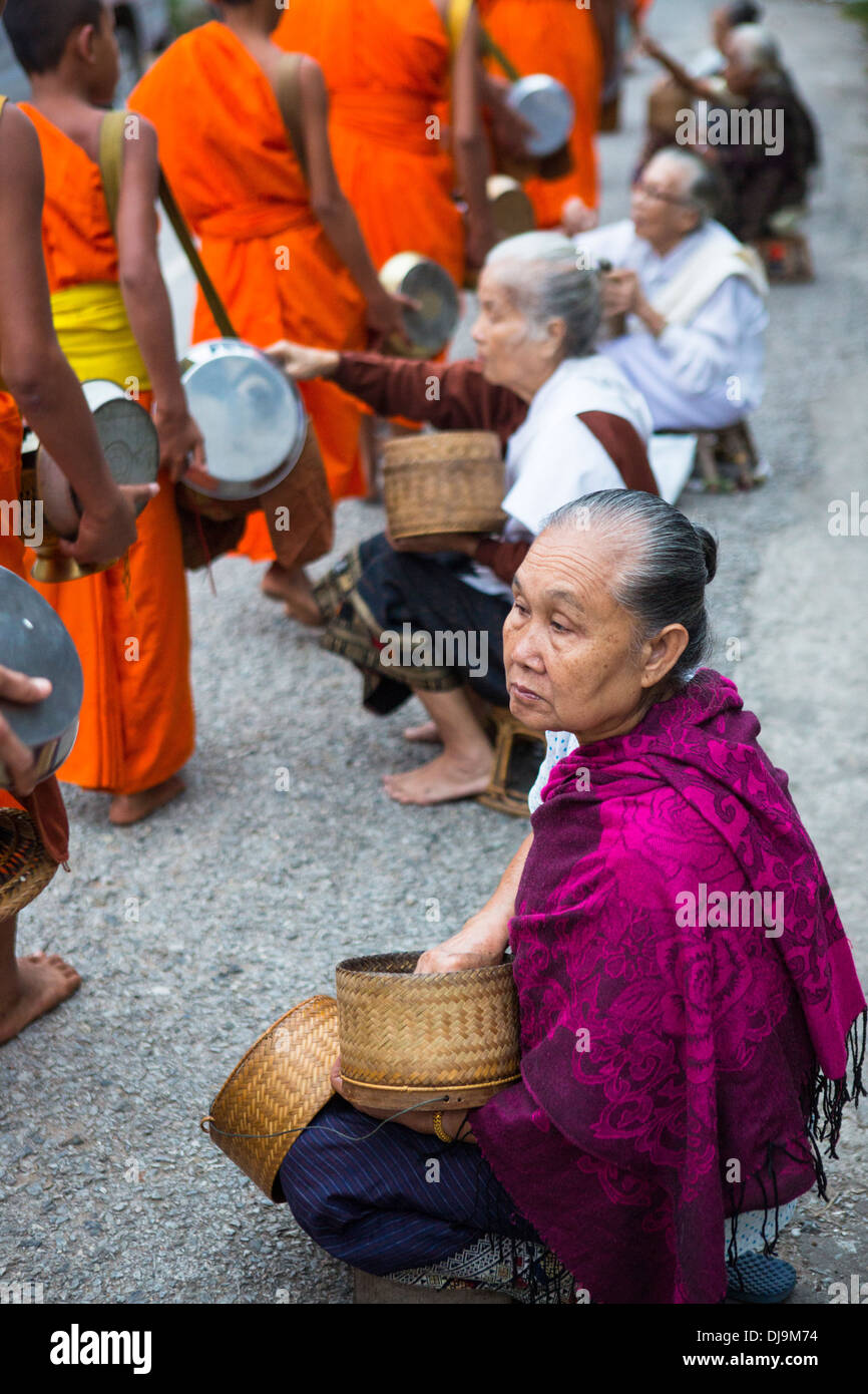 Alms giving ceremony in Luang Prabang, Laos Stock Photo