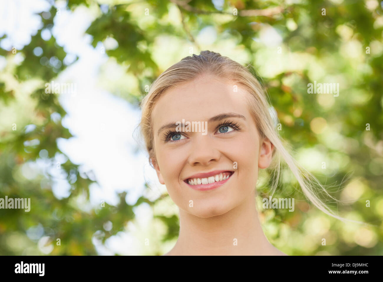 Cheerful beautiful young woman standing hi-res stock photography and ...