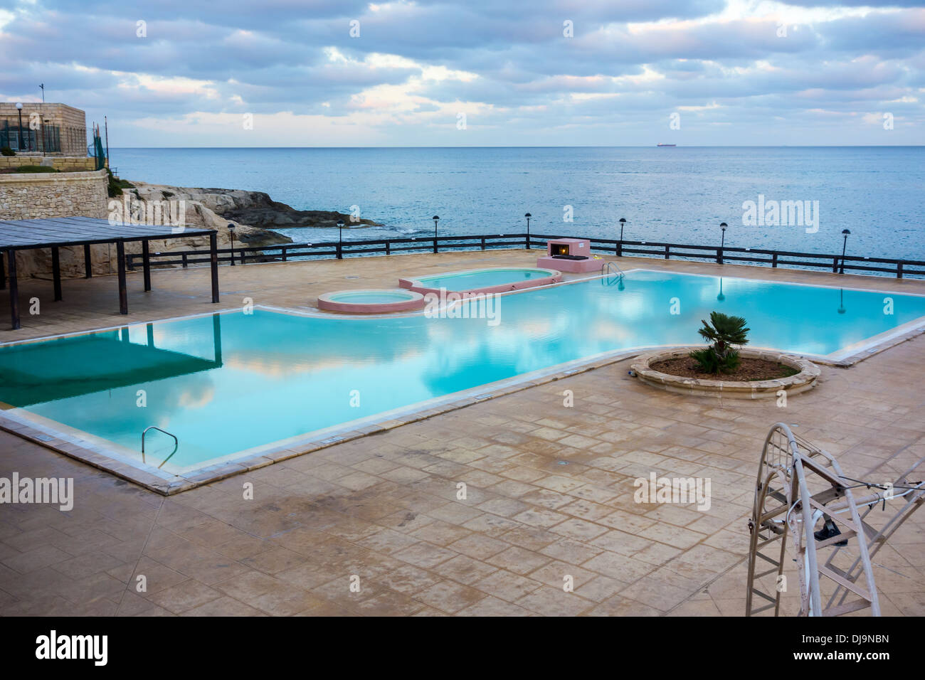 The Westin Hotel and Resort Dragonara Island of Malta Mediterranean Sea Europe Reef Club Swimming Pool looking out to sea Stock Photo