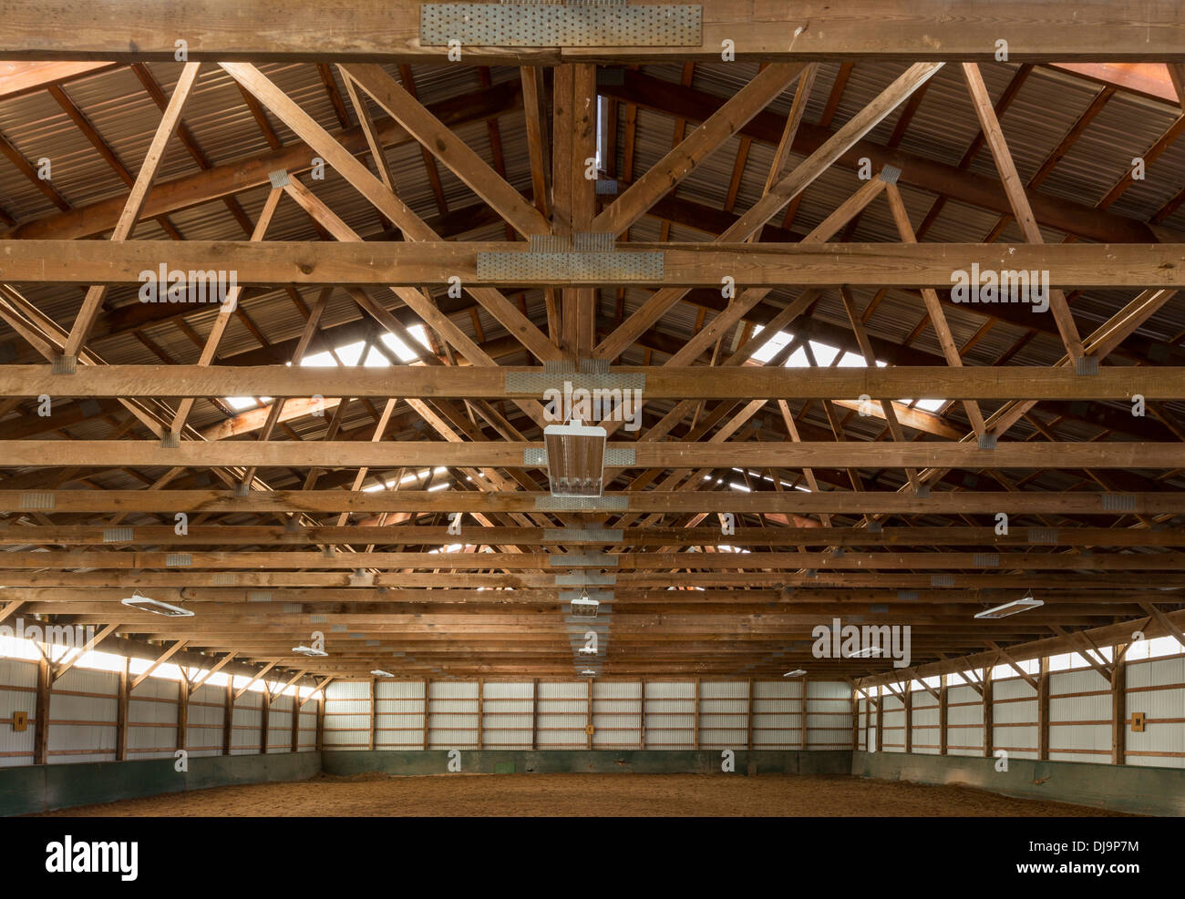 Wooden rafters in indoor horse riding ring Stock Photo