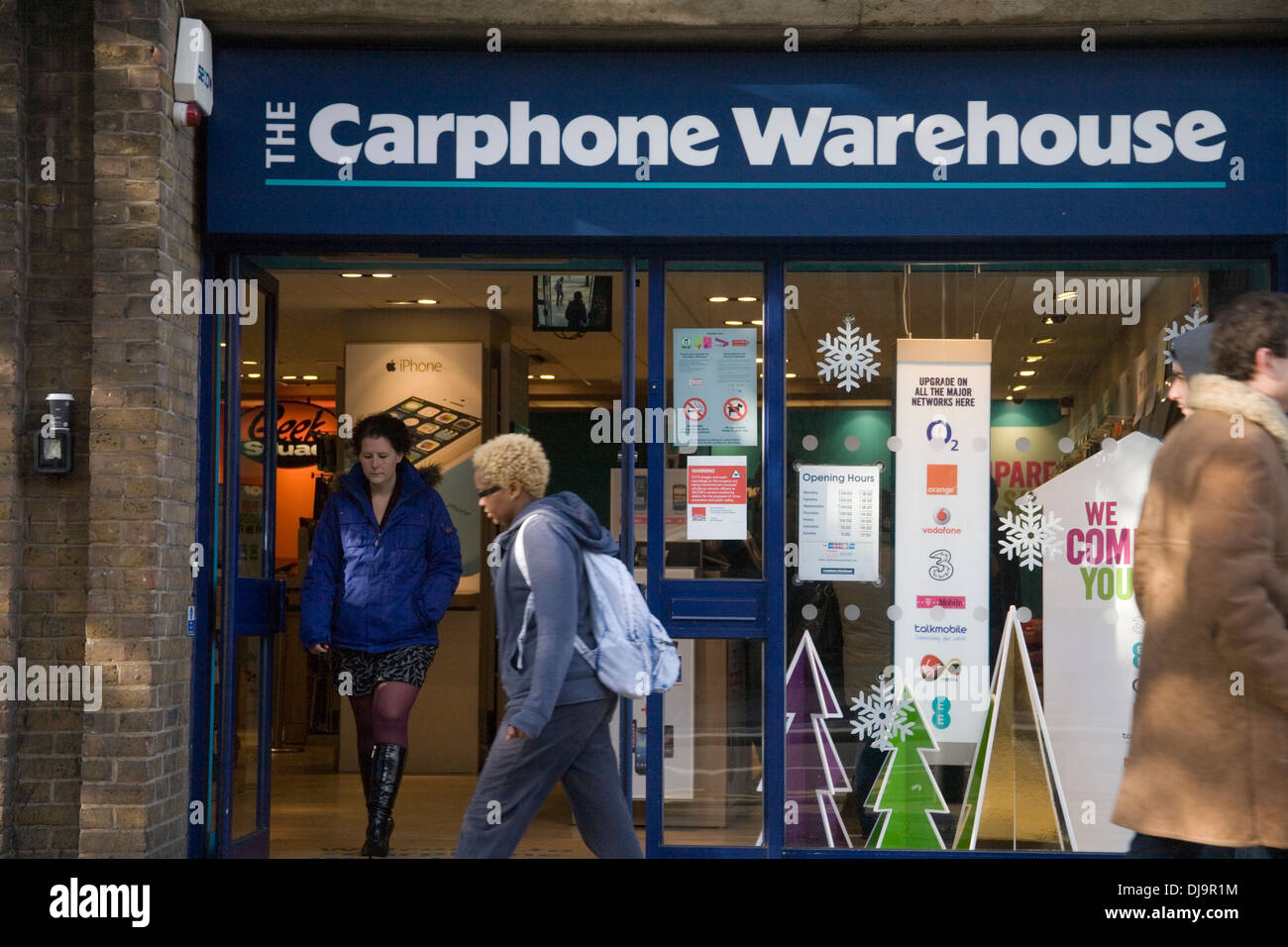 Carphone Warehouse shop front on high street with people walking past Stock Photo