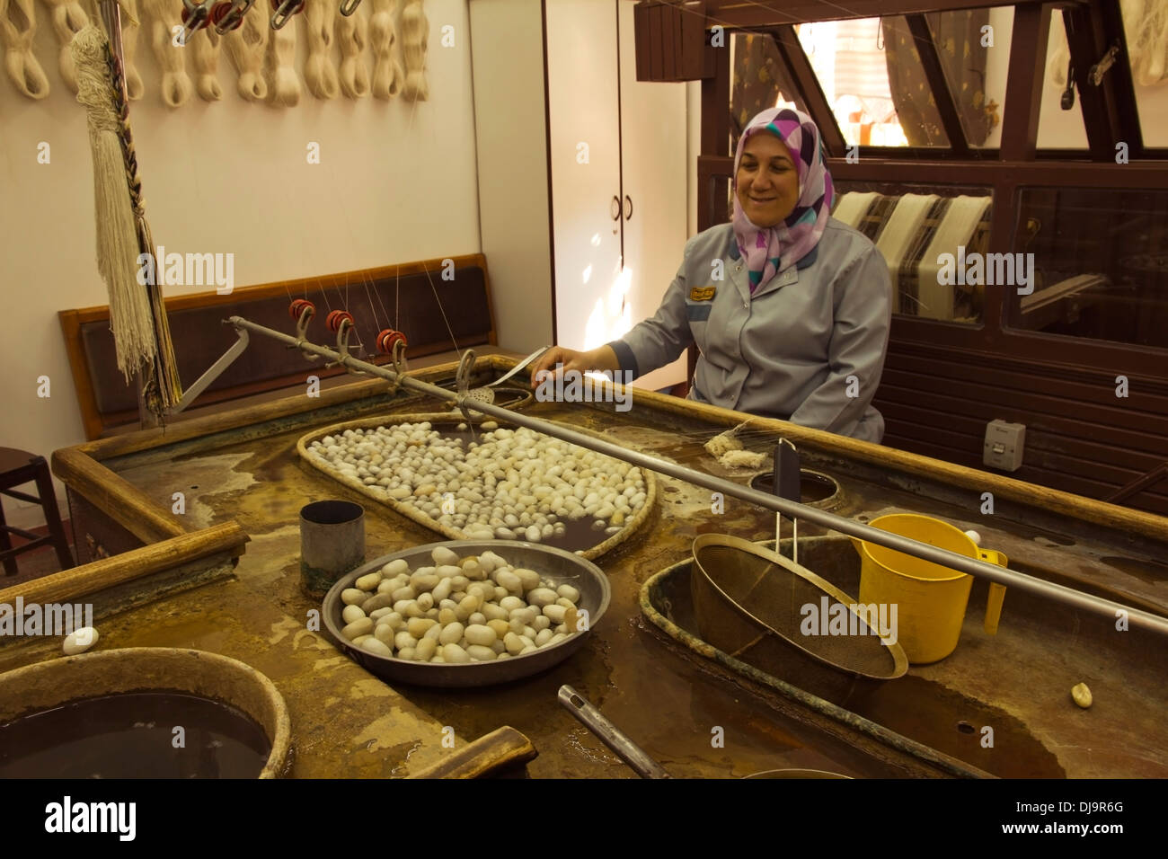 cocoons, silk, cotton, carpet making, woman sitting Stock Photo