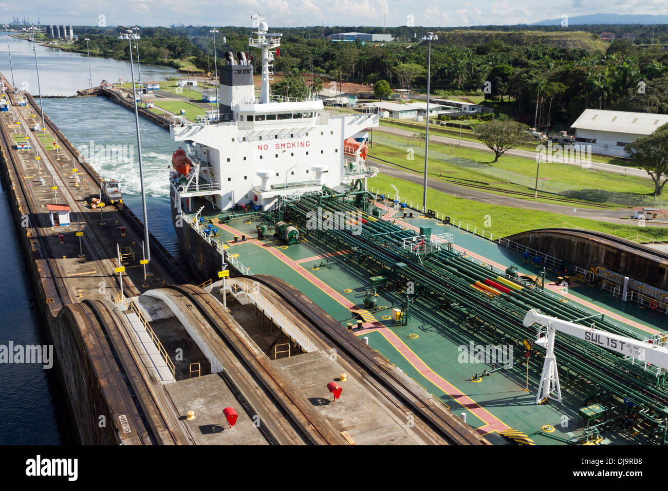 Empty cargo ship passing through the Gatun Locks at the Panama Canal Stock Photo