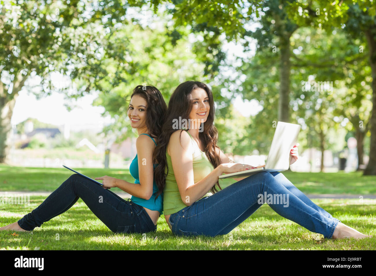 Two women sitting on the lawn hi-res stock photography and images - Alamy