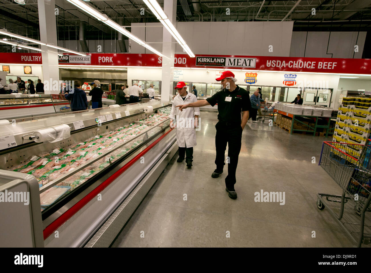 COSTCO employees arrange items in newly open store in Texas Stock Photo