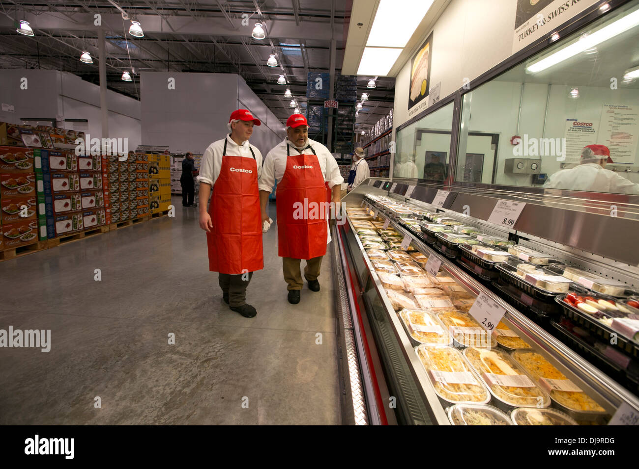 Costco warehouse employees in the fresh meat department discuss merchandise  at a newly open store in Cedar Park, Texas Stock Photo - Alamy