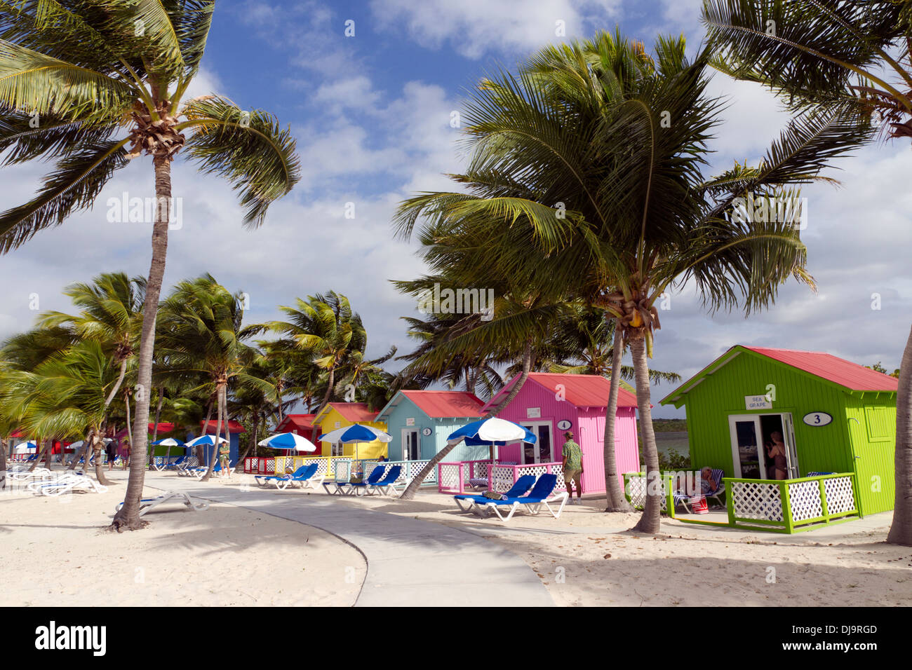 Colorful beach huts front the Caribbean Sea on the Bahamian Island of Eleuthera Stock Photo