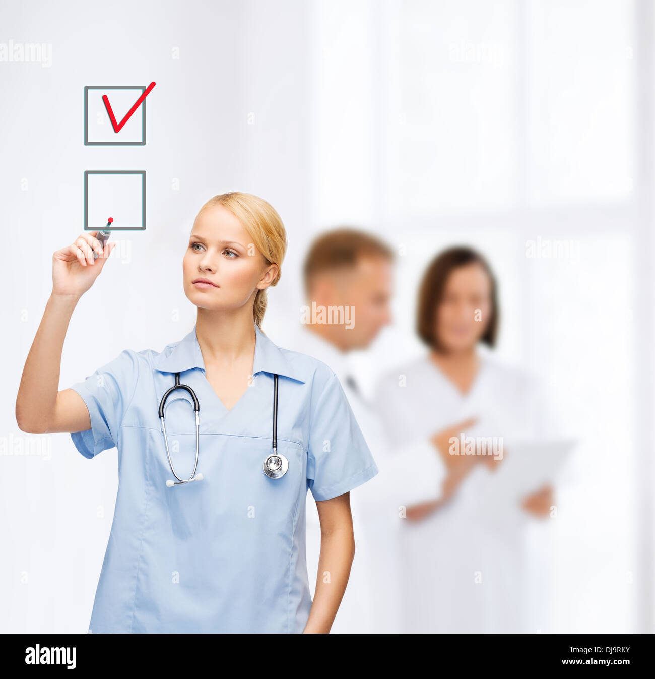 doctor or nurse drawning checkmark into checkbox Stock Photo - Alamy