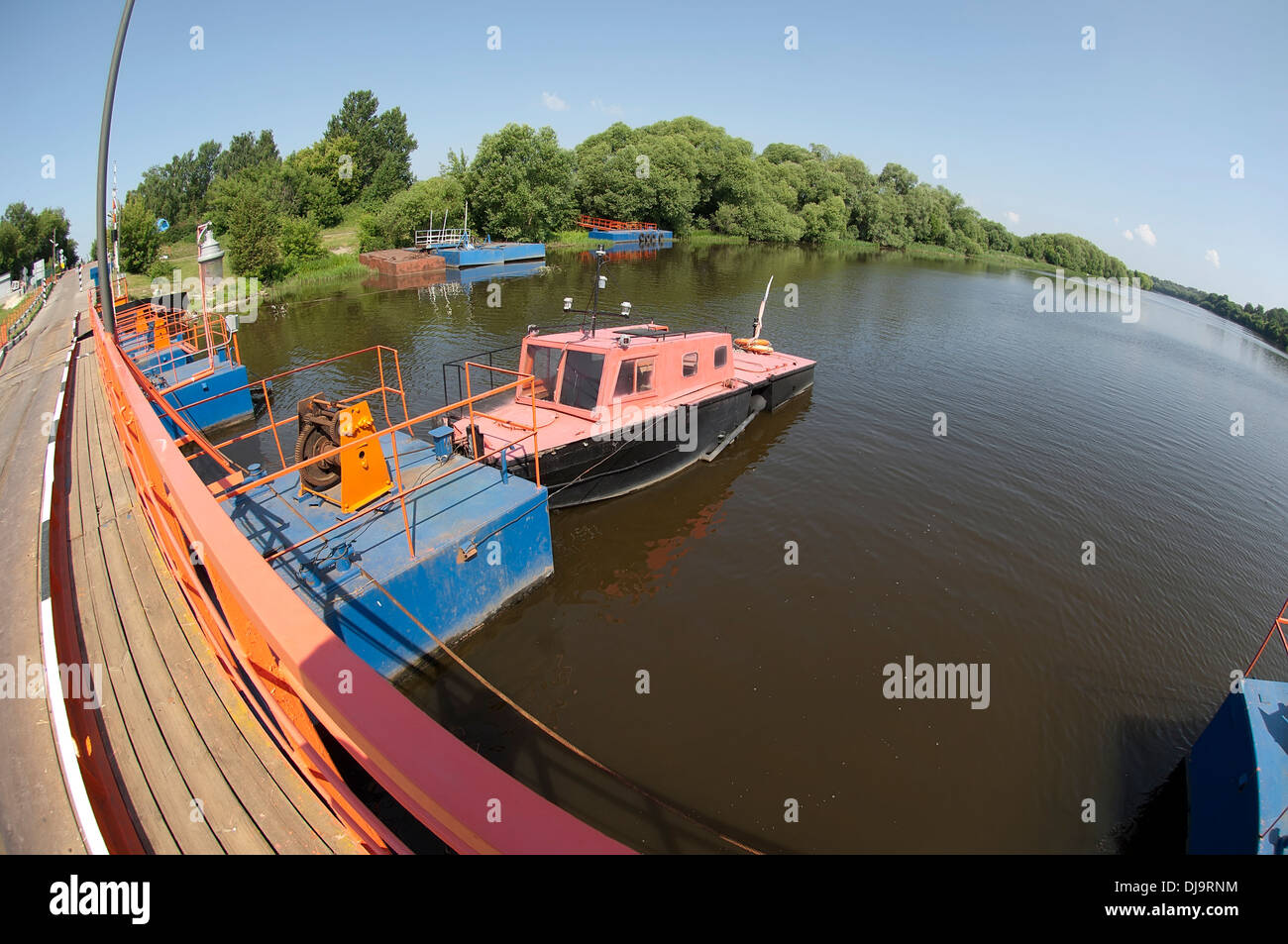 River bridge in fisheye view in sunny summer day. Village Cherkizovo, Moscow region, Russia Stock Photo