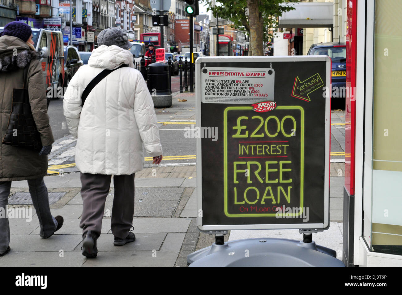 A shop pavement sign reading ' £200 interest free loan', Kilburn High Road, London Stock Photo