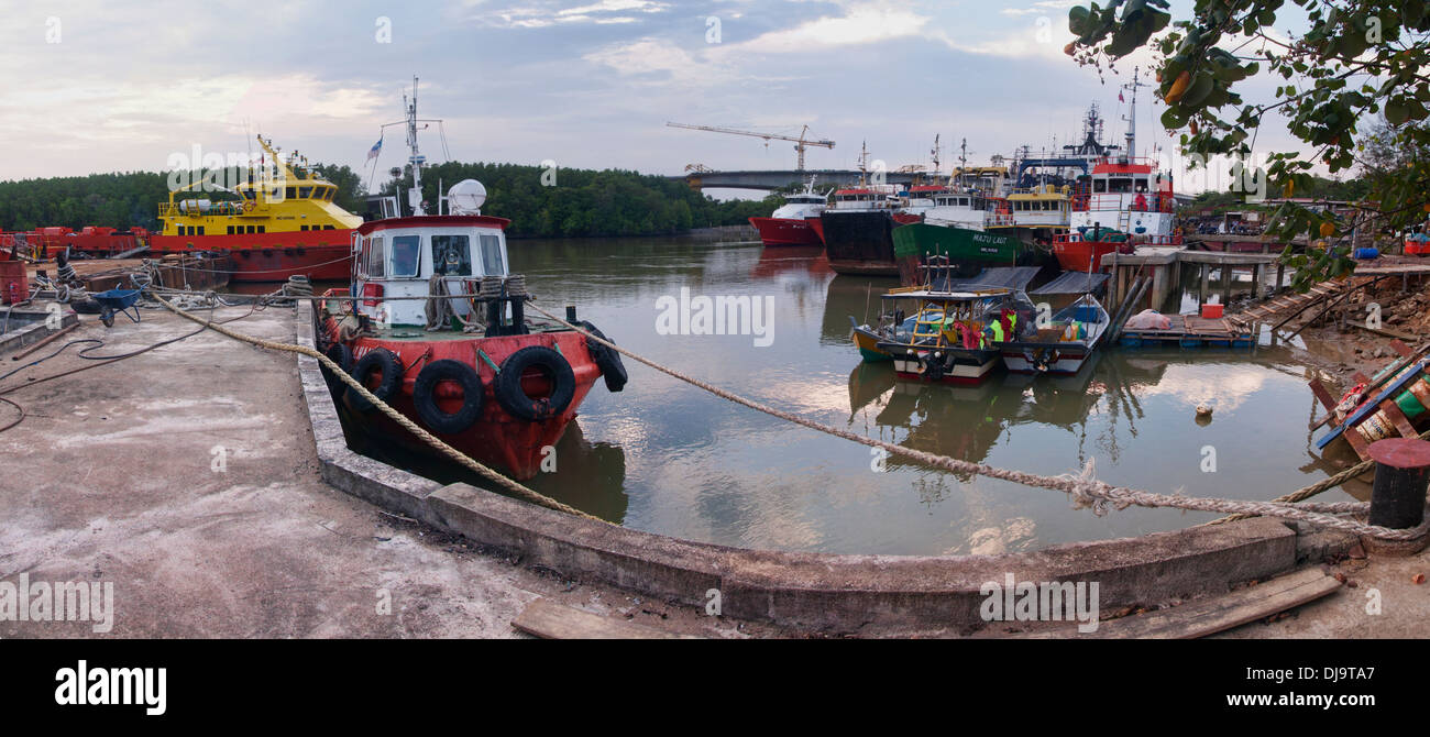 river jetty with boat berthing Stock Photo