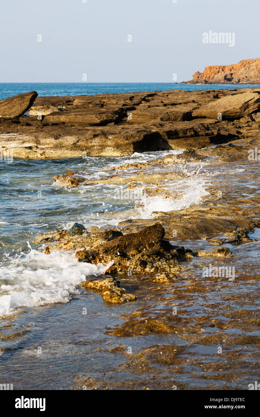 Surf crashing on rocks at Nea Dimmata on the west coast of Cyprus, between Paphos and Polis. Stock Photo