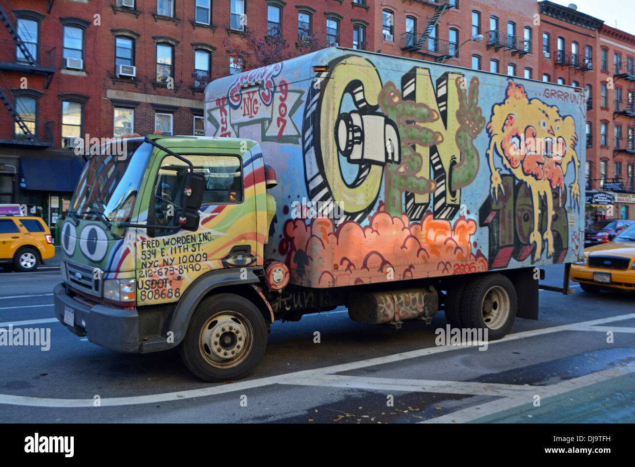 A truck with painted graffiti parked on First avenue in the East Village, New York City Stock Photo
