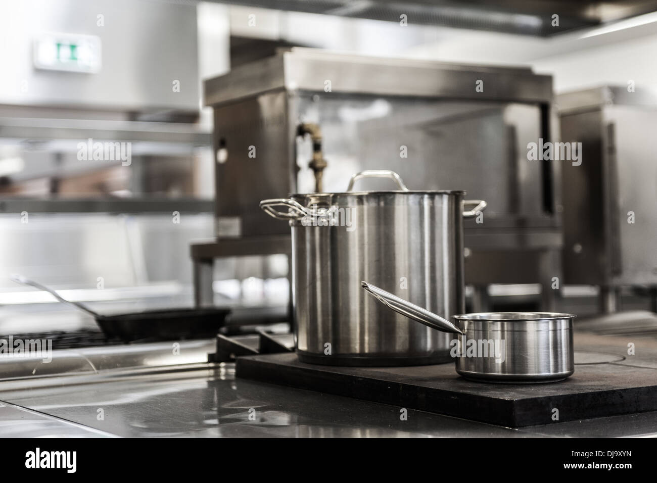 Pots standing on hotplate Stock Photo