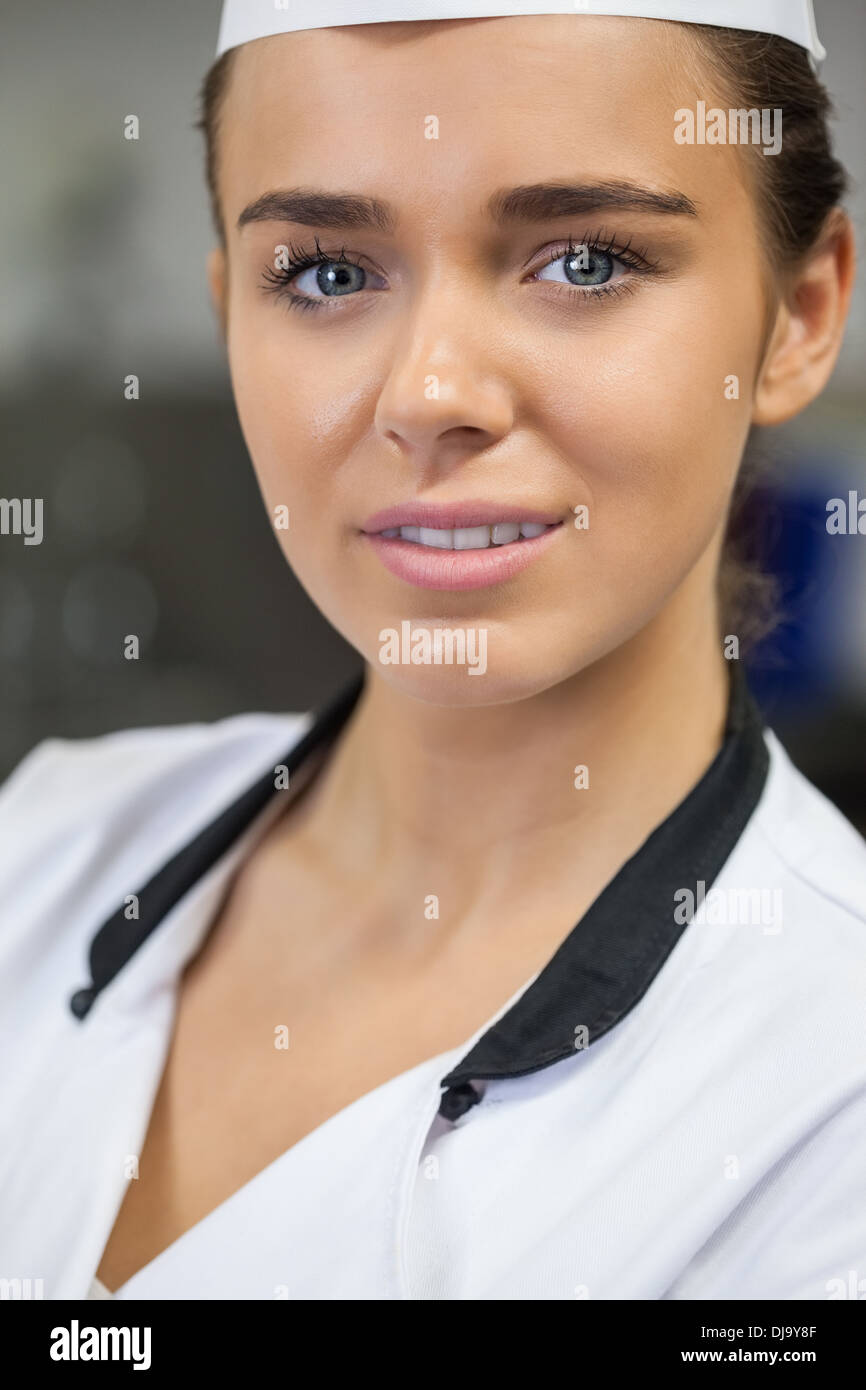 Young smiling chef looking at camera Stock Photo