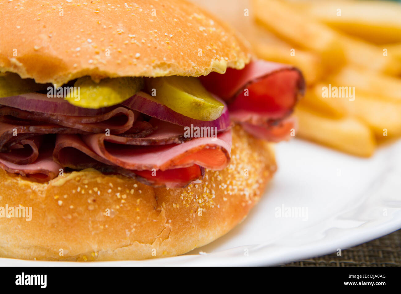 Roast beef sandwich with fries Stock Photo Alamy