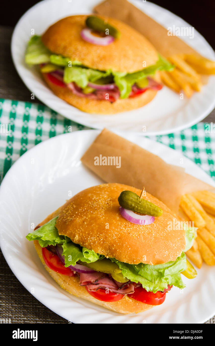 Roast beef sandwich with fries Stock Photo Alamy