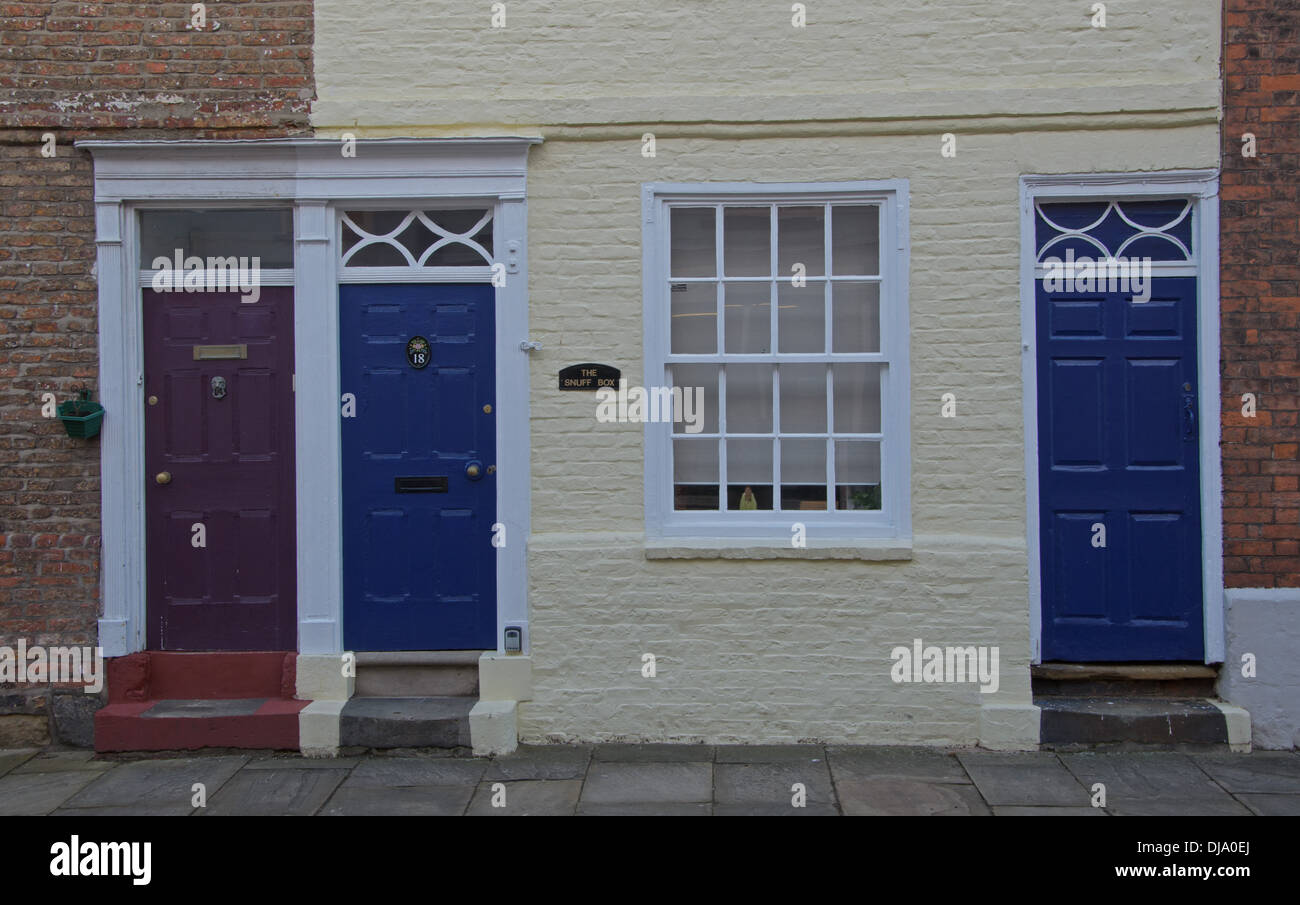 Street view of blue doors of town Houses Bridlington Old Town East