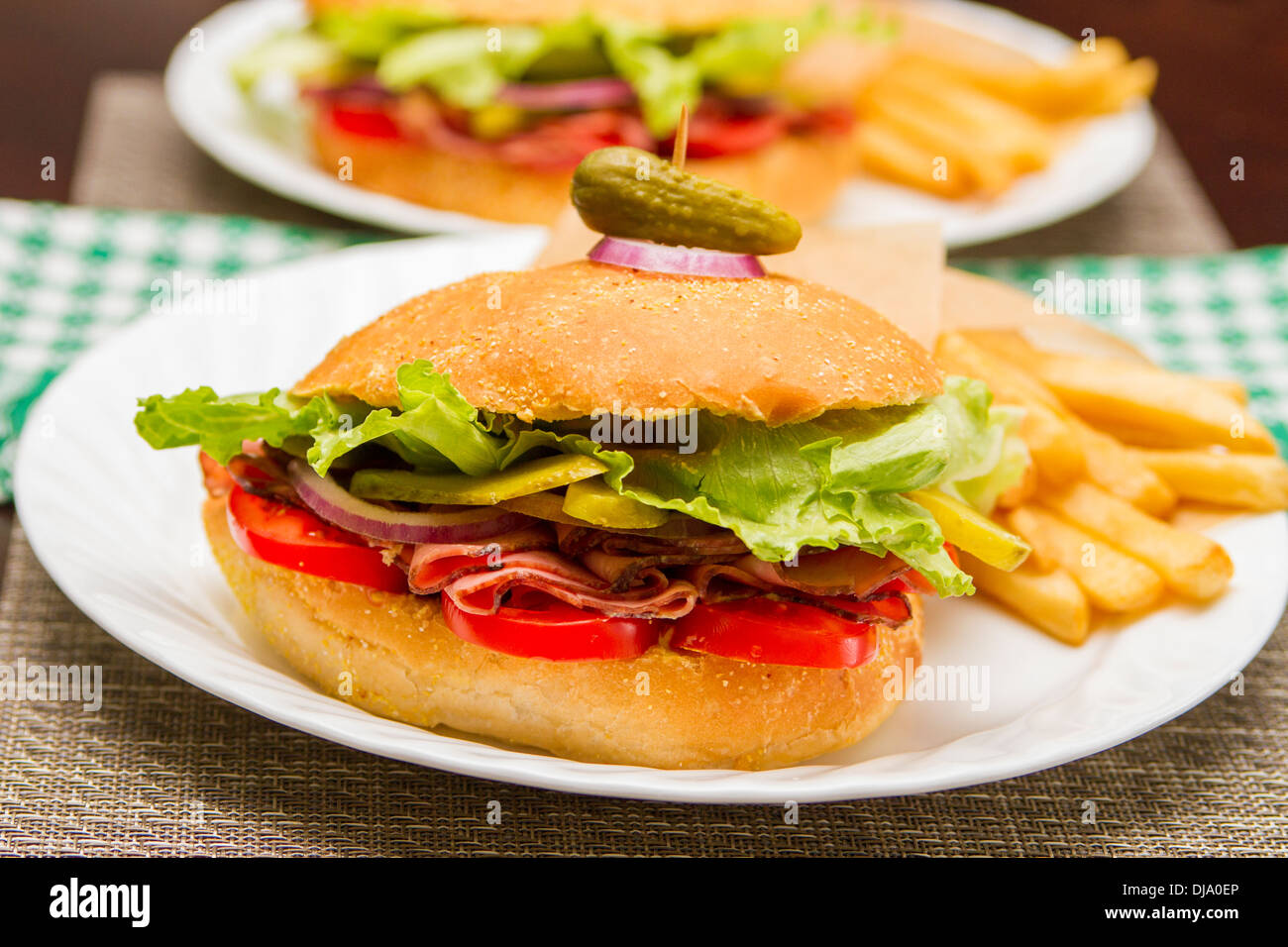 Roast beef sandwich with fries Stock Photo Alamy