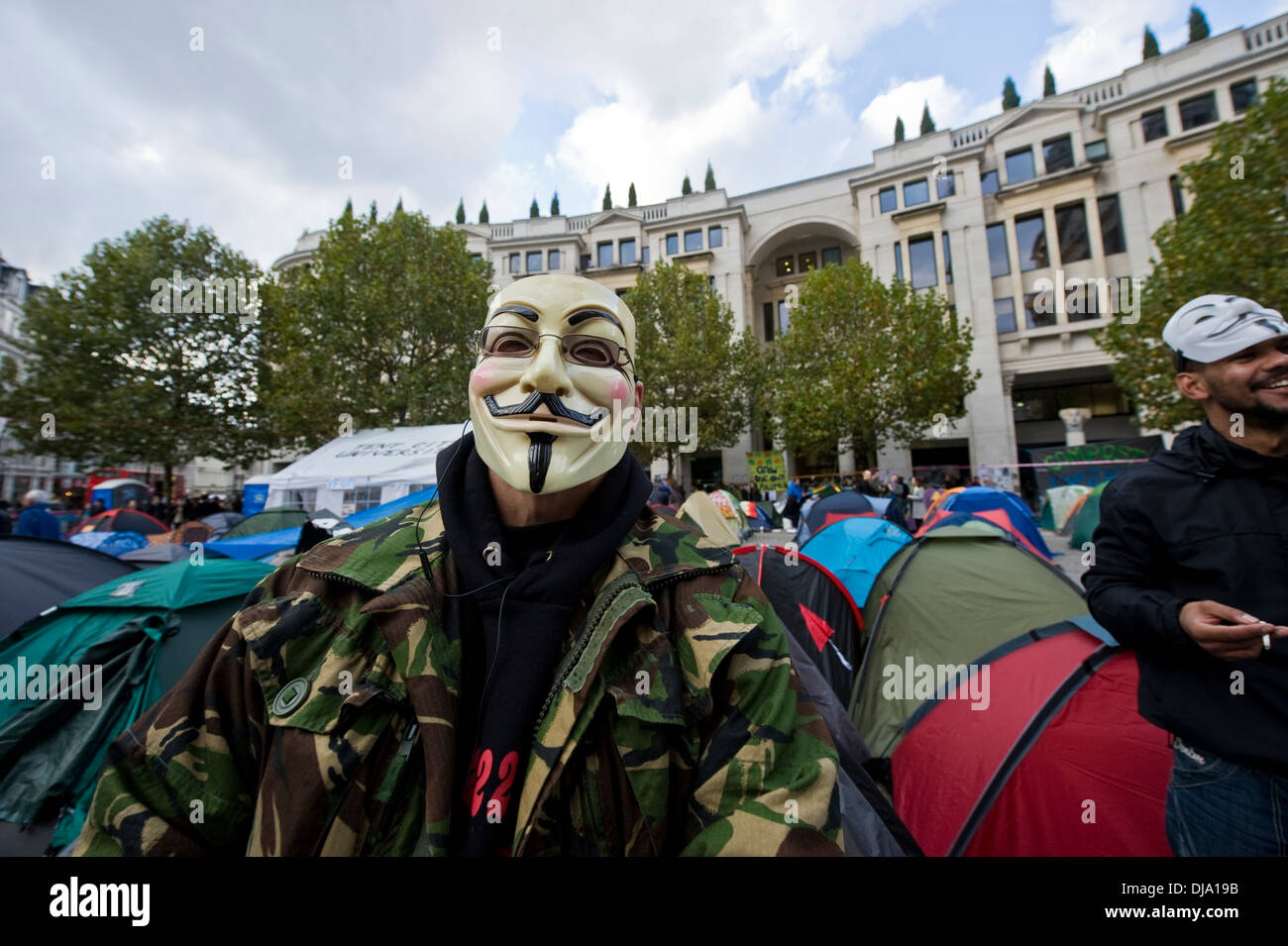 A demonstrator in London at St Paul's cathedral in a Guy Falkes mask Stock Photo