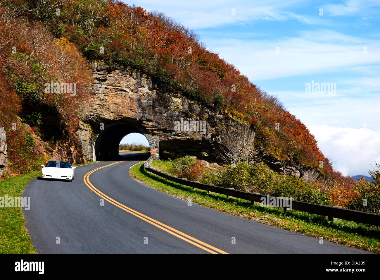 A traveler in a sports car passes through the Craggy Pinnacle Tunnel on the Blue Ridge Parkway near Asheville North Carolina. Stock Photo