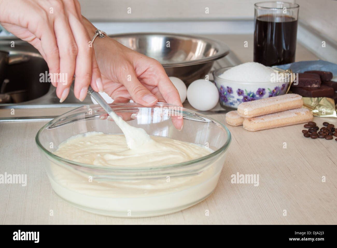 hands cooking Tiramisu kitchen ingredients Stock Photo