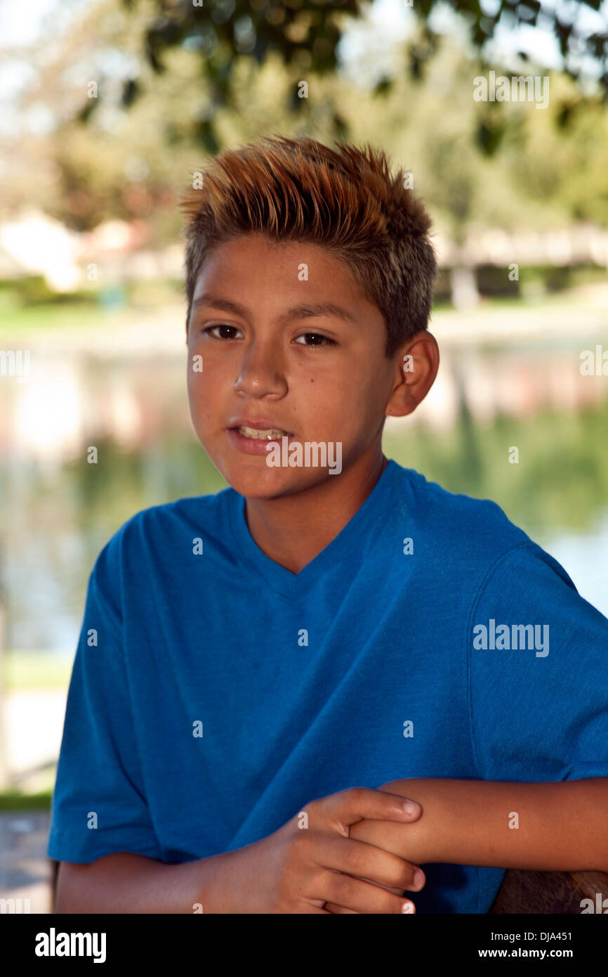 11-13 year old Hispanic boy outside multi racial diversity racially diverse multicultural cultural United States MR © Myrleen Pearson Stock Photo