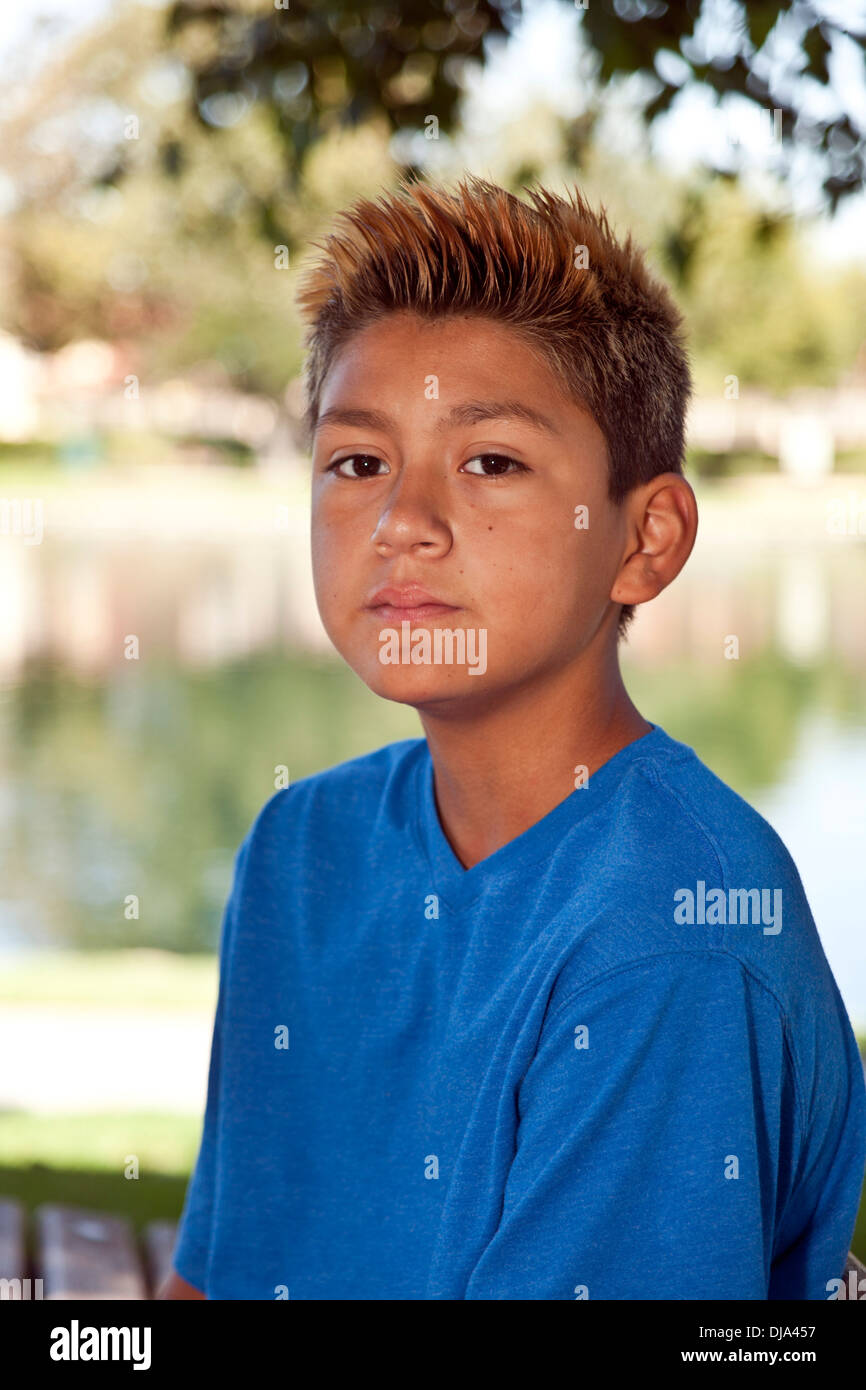 multi ethnic multi racial diversity racially diverse multicultural multi cultural 11-13 year years old Hispanic boy in park. MR © Myrleen Pearson Stock Photo