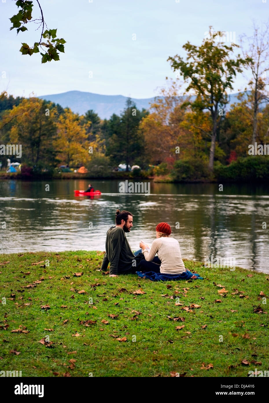 A couple enjoying an autumn day by the lake at The Leaf Festival (Lake Eden Arts Festival), Black Mountain North Carolina. Stock Photo