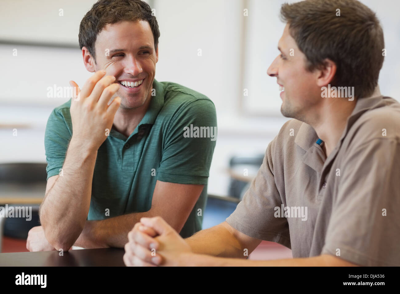 Two friendly male mature students chatting Stock Photo