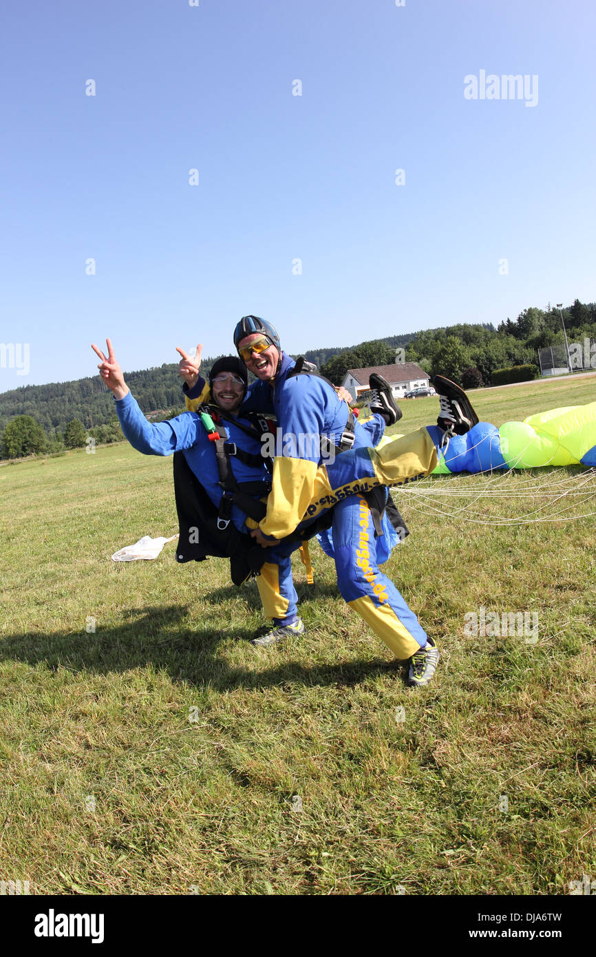 This skydivers are landed with their parachutes and now they are very