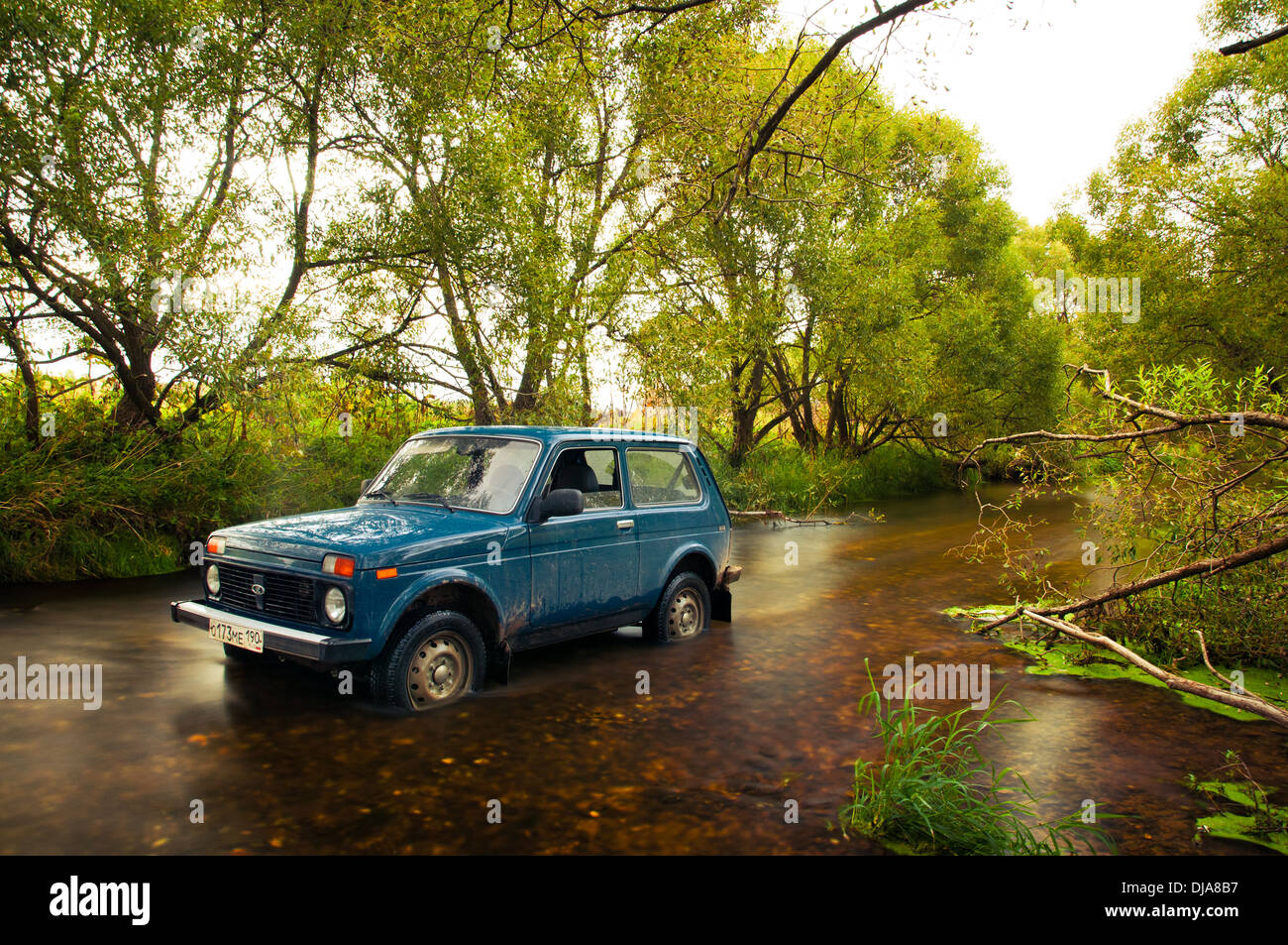Soviet and Russian SUV Lada Niva 4x4 in water Stock Photo - Alamy