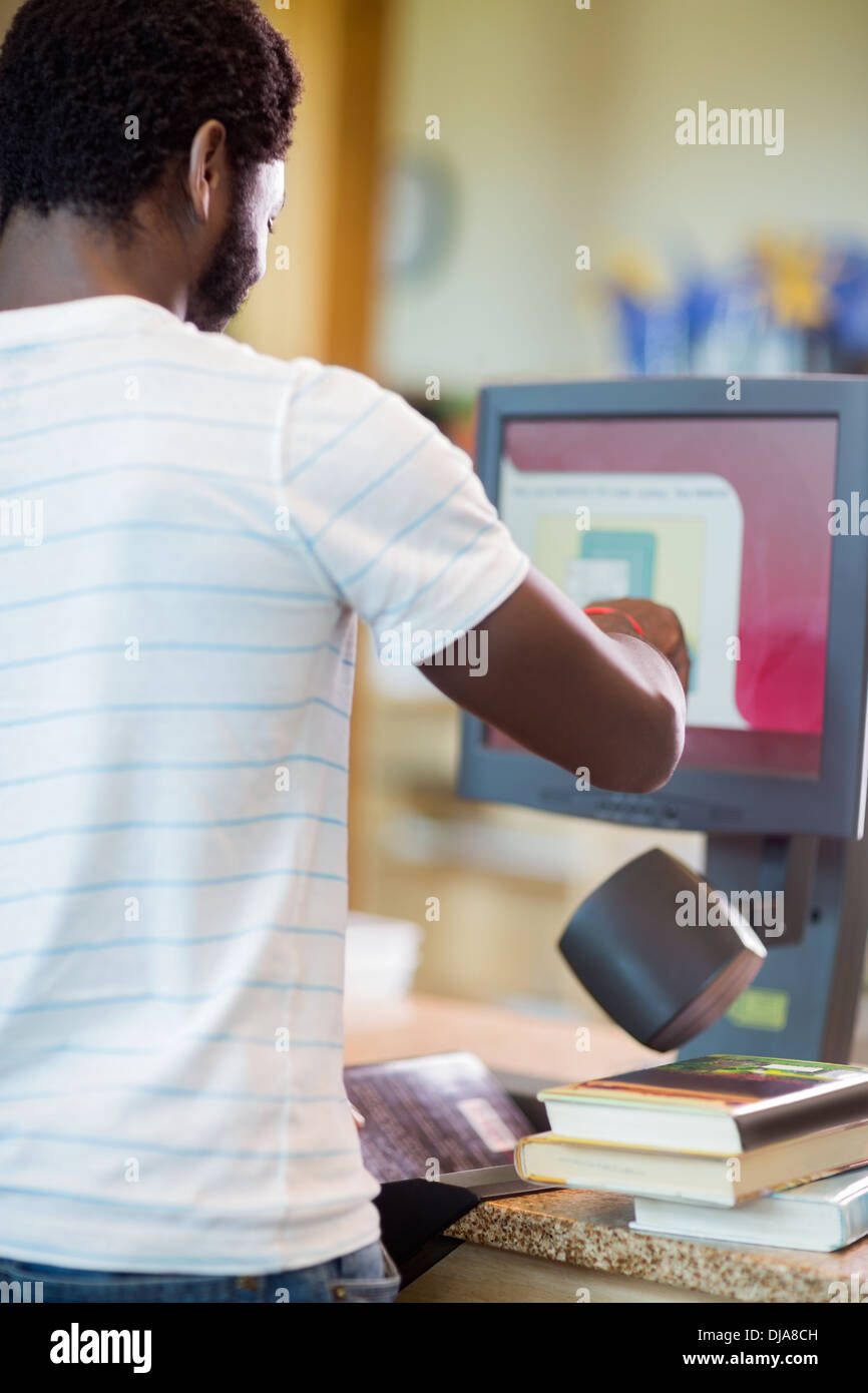 Librarian Scanning Books At Library Counter Stock Photo Alamy