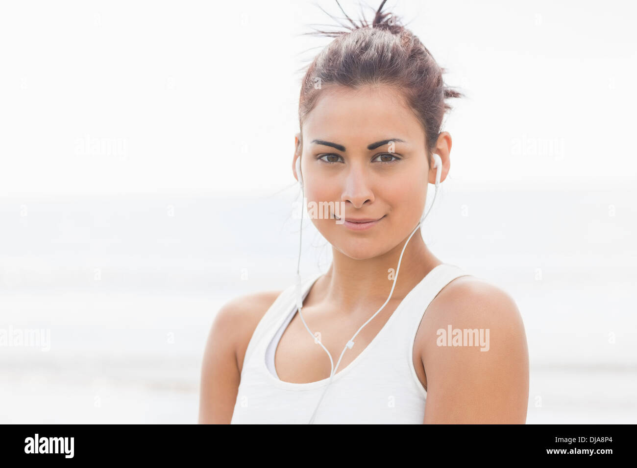 Cute young woman posing looking at camera Stock Photo - Alamy