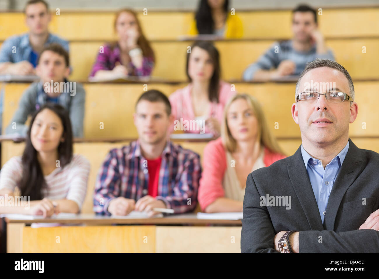 Elegant teacher with students at the lecture hall Stock Photo