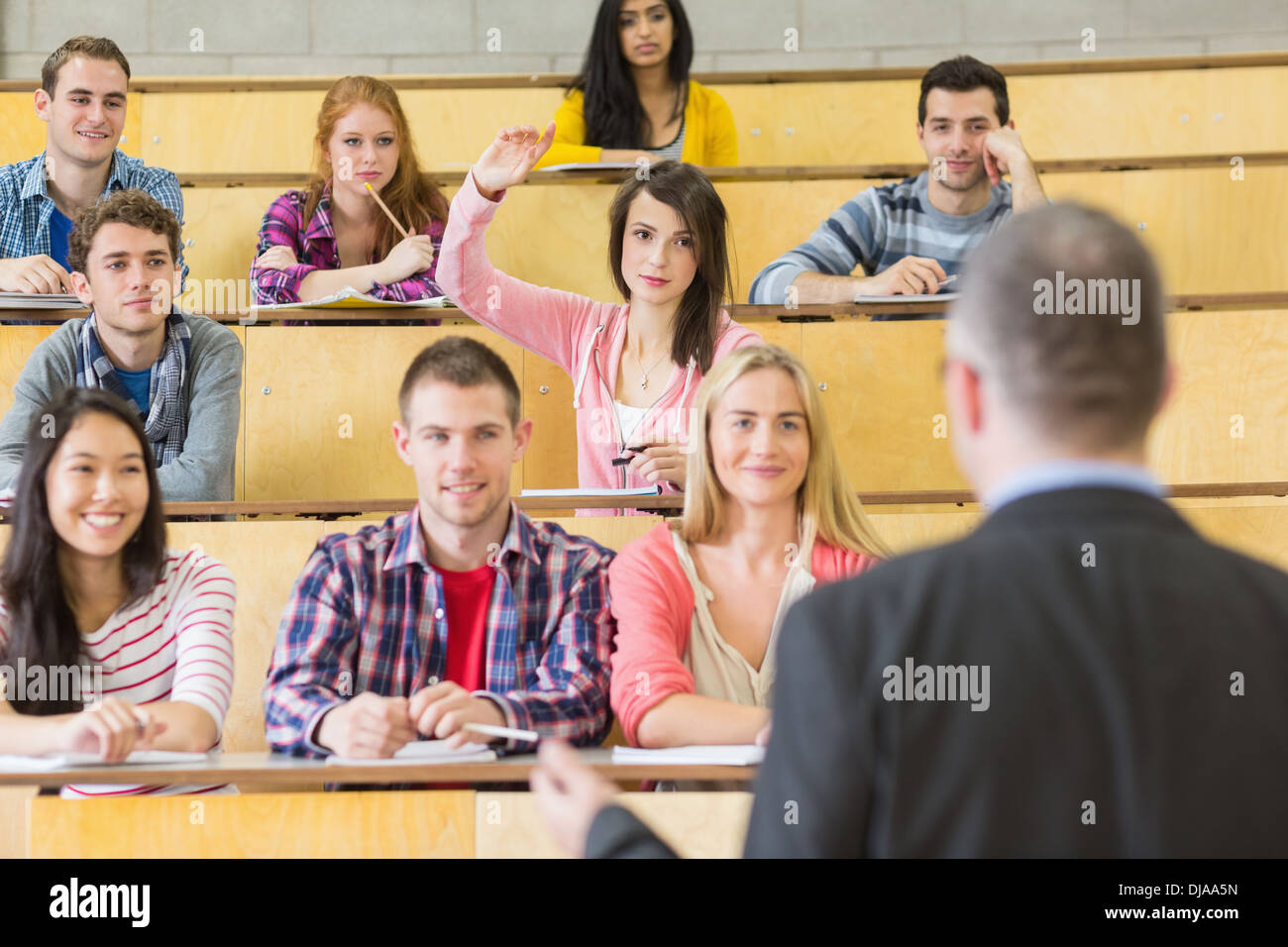 Elegant teacher with students at the lecture hall Stock Photo