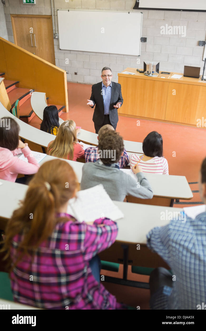 Elegant teacher with students at the lecture hall Stock Photo