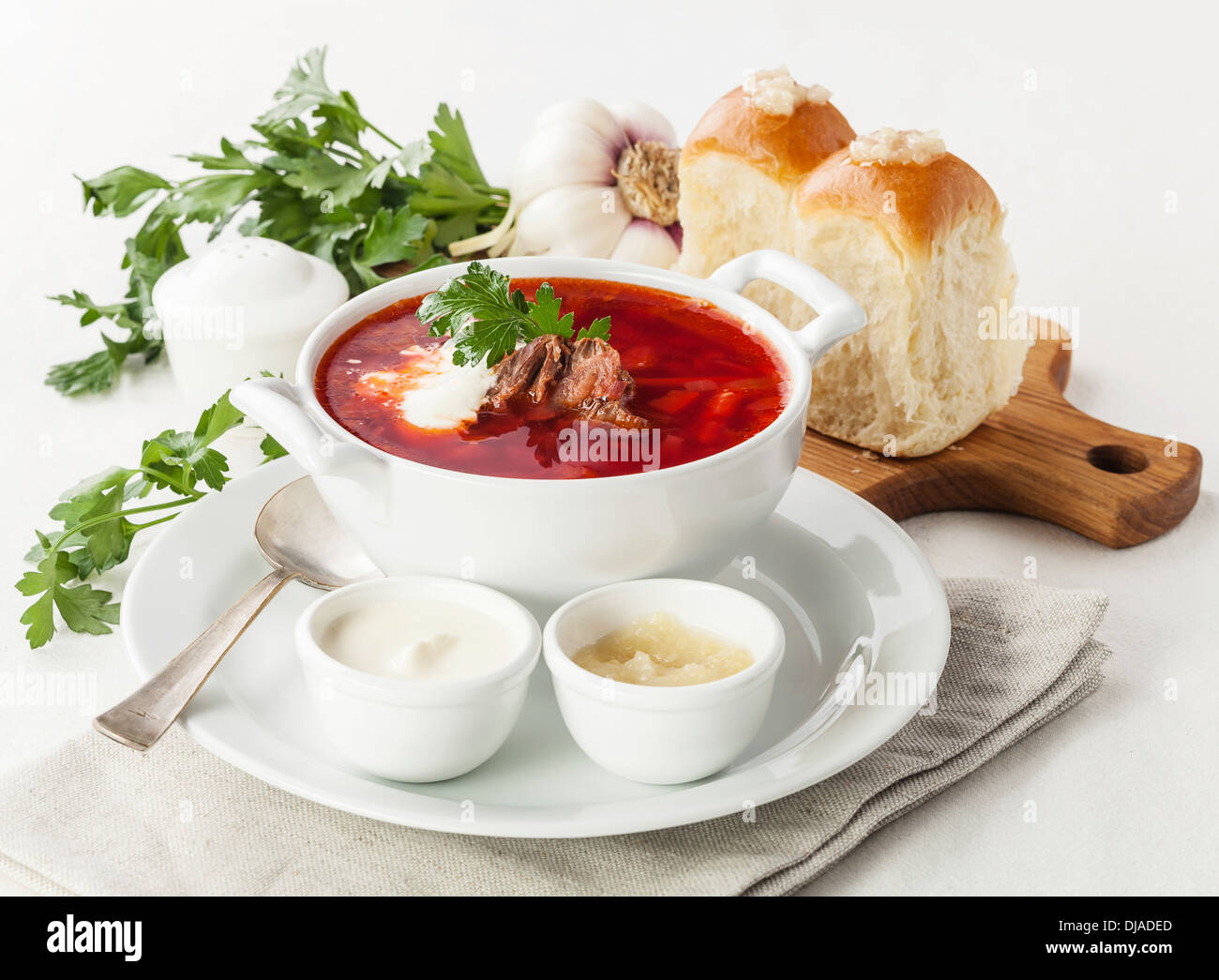 Red borsch with traditional Ukrainian bread pampushki Stock Photo