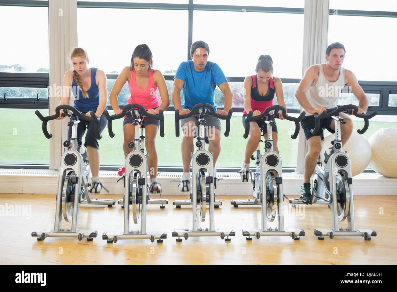 Determined people working out at spinning class in gym Stock Photo - Alamy
