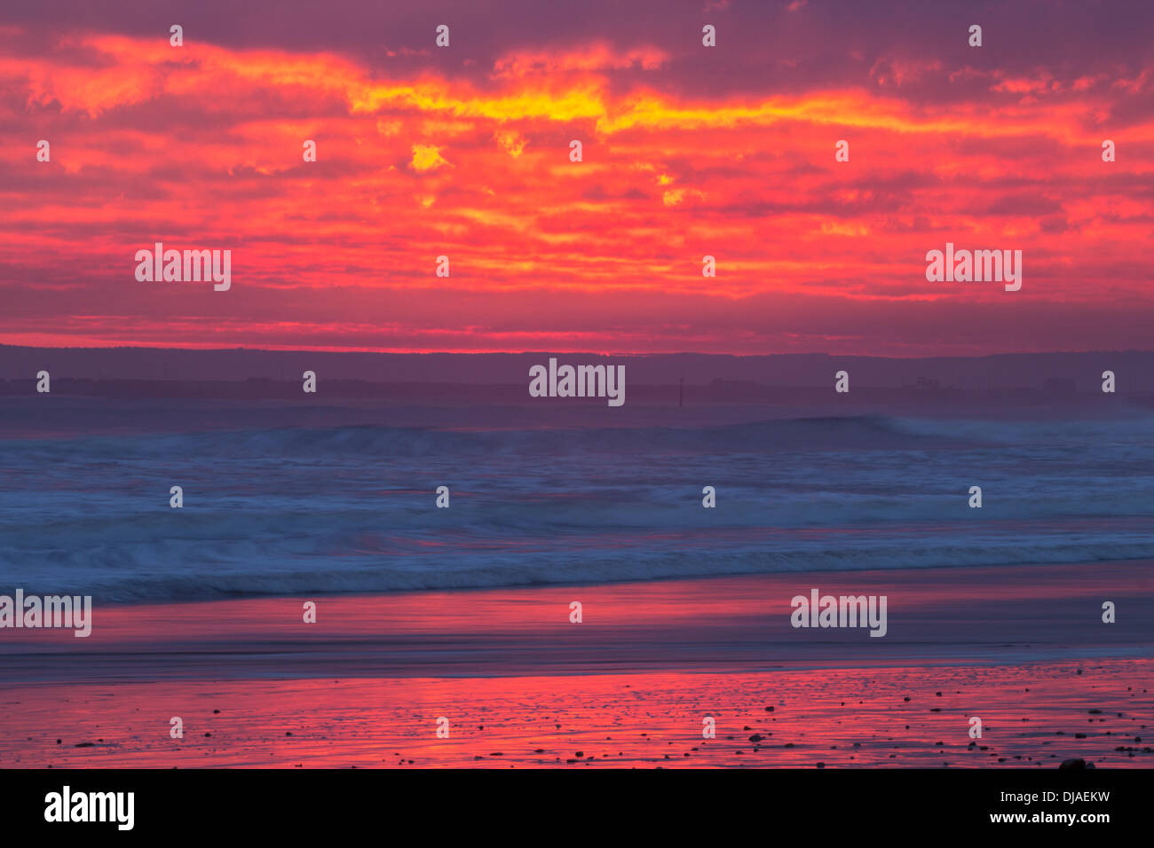 Seaton Carew near Hartlepool, UK. 26th Nov, 2013.  Dramatic sunrise from Seaton Carew beach on the north east coast of England as temperatures are forecast to rise midweek before cold air returns from the north west at the weekend Credit:  ALANDAWSONPHOTOGRAPHY/Alamy Live News Stock Photo