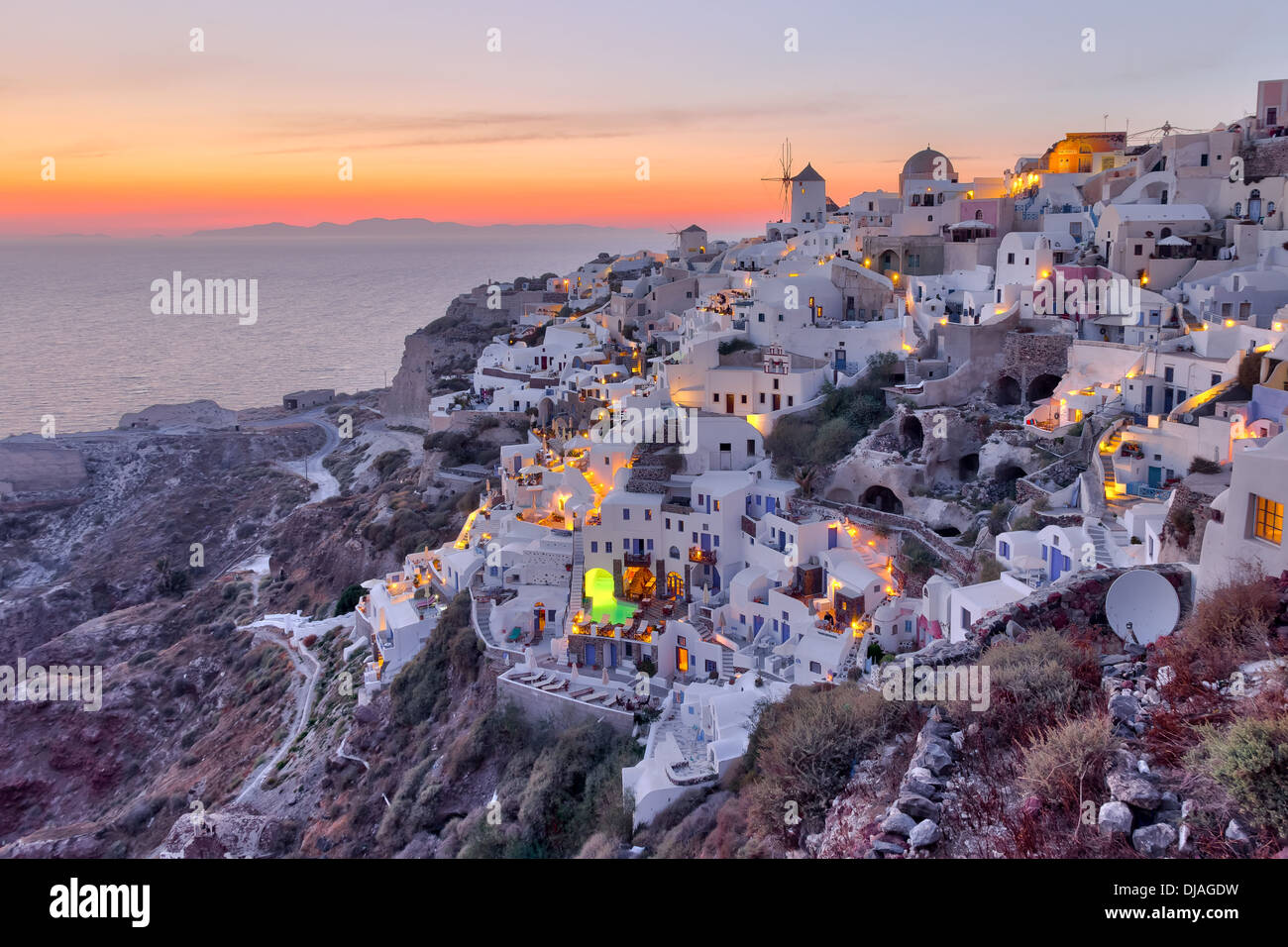 Beautiful Oia village sunset in Santorini island Greece photographed from a high point of view in high dynamic range (HDR) Stock Photo