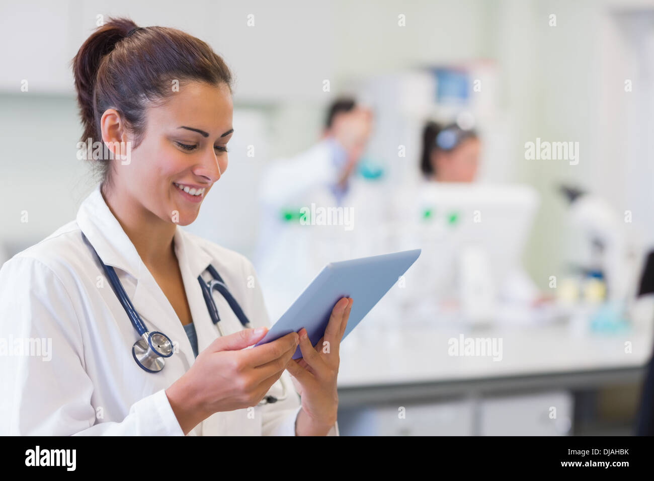 Close up of a female doctor using tablet PC Stock Photo