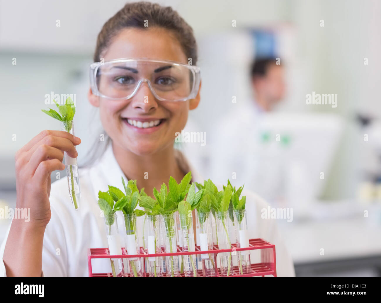 Young smiling female scientist hi-res stock photography and images - Alamy
