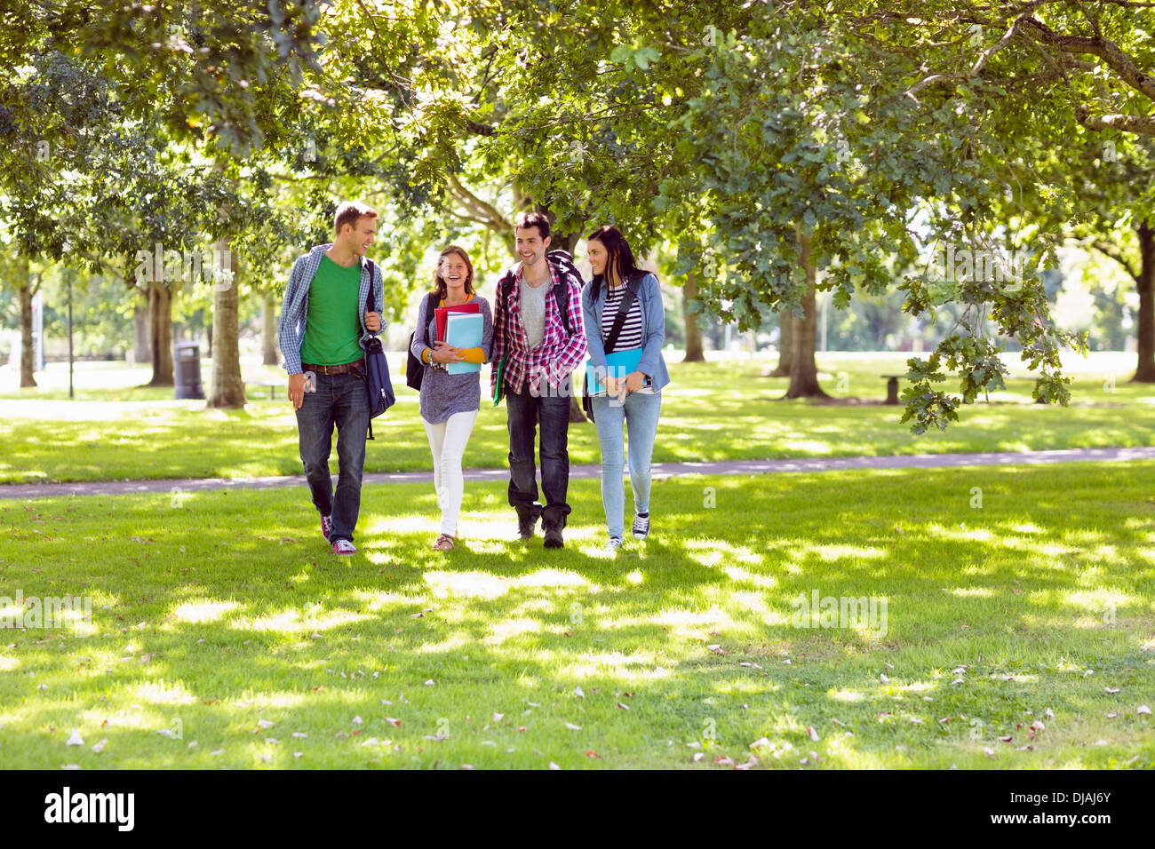 Froup of college students walking in the park Stock Photo - Alamy